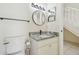 Bathroom featuring granite vanity, framed mirror, updated fixtures, and tiled floors at 9473 N Forest Hills Pl, Tampa, FL 33612