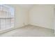 Carpeted bedroom with window and a closet at 9473 N Forest Hills Pl, Tampa, FL 33612