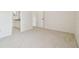 Neutral carpeted bedroom with en-suite bathroom at 9473 N Forest Hills Pl, Tampa, FL 33612