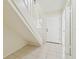 Bright foyer with tiled flooring and a staircase leading to the second floor at 9473 N Forest Hills Pl, Tampa, FL 33612