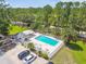 Community pool with white fencing is accessible by car with ample parking at 9473 N Forest Hills Pl, Tampa, FL 33612
