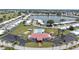 Aerial view of community clubhouse, pool, and manicured grounds at 9690 41St N St # 0, Pinellas Park, FL 33782