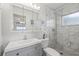 Modern bathroom featuring white tile and sleek vanity at 9690 41St N St # 0, Pinellas Park, FL 33782