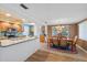 Open concept kitchen and dining area with views and natural light, perfect for entertaining at 9690 41St N St # 0, Pinellas Park, FL 33782