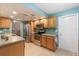 Cozy kitchen featuring stainless steel appliances, wood cabinetry, and bright, airy lighting at 9690 41St N St # 0, Pinellas Park, FL 33782