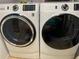 Modern laundry room featuring a new GE washer and dryer set at 9690 41St N St # 0, Pinellas Park, FL 33782