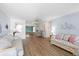 Bright living room with hardwood floors, neutral paint, and comfortable seating arrangement at 9690 41St N St # 0, Pinellas Park, FL 33782