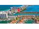 Beautiful aerial view of waterfront homes on the bay and beach with city views at 101 Marina Del Rey Ct, Clearwater, FL 33767