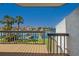 Balcony view overlooking a marina, showcasing waterfront property with clear blue sky at 101 Marina Del Rey Ct, Clearwater, FL 33767