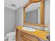 Elegant bathroom with a decorative mirror, vanity, and a traditional-style toilet at 101 Marina Del Rey Ct, Clearwater, FL 33767