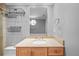 Bathroom features a vanity with a stone countertop, storage baskets, and a large mirror at 101 Marina Del Rey Ct, Clearwater, FL 33767