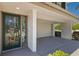 Charming home exterior with a beautiful stained-glass door, garage, and well-maintained landscaping at 101 Marina Del Rey Ct, Clearwater, FL 33767