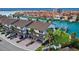 Waterfront townhome with attached parking, well-maintained landscaping, and brick-paved driveway at 101 Marina Del Rey Ct, Clearwater, FL 33767