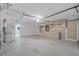 Spacious garage featuring ample storage cabinets, pegboard walls, and well-lit interiors at 101 Marina Del Rey Ct, Clearwater, FL 33767