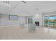 Bright living room showcasing a fireplace, tile flooring, and sliding glass doors to a private balcony at 101 Marina Del Rey Ct, Clearwater, FL 33767