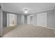 Spacious carpeted main bedroom with multiple closets, neutral paint and a ceiling fan at 101 Marina Del Rey Ct, Clearwater, FL 33767