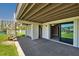 Outdoor patio featuring spiral staircase, sliding glass door access, and waterfront views at 101 Marina Del Rey Ct, Clearwater, FL 33767