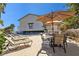 Community pool area with lounge chairs, tables, umbrellas, and lush landscaping at 101 Marina Del Rey Ct, Clearwater, FL 33767