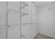 Walk-in closet features white wire shelving throughout for optimal storage at 101 Marina Del Rey Ct, Clearwater, FL 33767