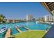 Scenic water view showcasing a dock, boats, and waterfront buildings, set against a clear blue sky at 101 Marina Del Rey Ct, Clearwater, FL 33767