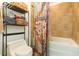 Nicely appointed bathroom features a shower-tub combo and stylish shelving for organization at 101 N 12Th St # 400, Tampa, FL 33602