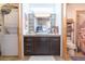 This bathroom offers a shower, a wash machine and dryer, and an updated vanity at 101 N 12Th St # 400, Tampa, FL 33602