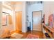 Stylish foyer featuring a wooden bench, mirror, and coat storage next to the front door at 101 N 12Th St # 400, Tampa, FL 33602