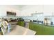 Modern kitchen with stainless steel appliances, green cabinets, and plenty of storage at 101 N 12Th St # 400, Tampa, FL 33602