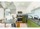 Bright kitchen with green cabinets, stainless steel appliances, and concrete ceilings at 101 N 12Th St # 400, Tampa, FL 33602