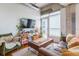 This modern living room offers tons of natural light and comfortable seating at 101 N 12Th St # 400, Tampa, FL 33602