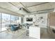 Modern living area with floor-to-ceiling windows and an open-concept kitchen at 101 N 12Th St # 400, Tampa, FL 33602