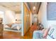 Open living room with exposed ceiling, sliding door, and bedroom nook in the background at 101 N 12Th St # 400, Tampa, FL 33602