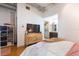 Bright main bedroom featuring a large TV, closet, and industrial chic accents at 101 N 12Th St # 400, Tampa, FL 33602