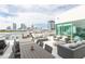 Relaxing rooftop deck with comfortable seating areas and stunning city views at 101 N 12Th St # 400, Tampa, FL 33602
