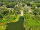 Scenic aerial view of a lush landscape with a boat ramp leading to a serene body of water at 1019 Lakeside Dr, Seffner, FL 33584