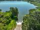 Aerial view of boat ramp leading into the serene, tree-lined lake at 1019 Lakeside Dr, Seffner, FL 33584