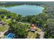 Beautiful aerial view showing a home near a large lake surrounded by green trees and nearby neighborhoods at 1019 Lakeside Dr, Seffner, FL 33584