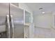 Bright kitchen featuring stainless steel refrigerator and light countertop, ready for cooking enjoyment at 1019 Lakeside Dr, Seffner, FL 33584