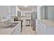 Modern kitchen with stainless steel appliances, white cabinets, and stylish countertops at 1019 Lakeside Dr, Seffner, FL 33584