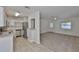 Open floor plan with a view of the kitchen and front door, blending living spaces at 1019 Lakeside Dr, Seffner, FL 33584