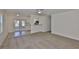 Spacious living room with an open layout and a view of the kitchen and dining area at 1019 Lakeside Dr, Seffner, FL 33584