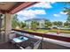 Balcony featuring an outdoor seating area with a view of the neighborhood and ample parking at 10265 Gandy N Blvd # 906, St Petersburg, FL 33702
