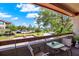 Outdoor seating area on balcony with a view of neighborhood park and parking spots at 10265 Gandy N Blvd # 906, St Petersburg, FL 33702