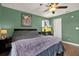 Cozy bedroom with an aquarium, wood floor, bedside lamps, and a calming atmosphere at 10265 Gandy N Blvd # 906, St Petersburg, FL 33702