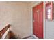 Inviting unit entrance with a red front door and a visible unit number at 10265 Gandy N Blvd # 906, St Petersburg, FL 33702