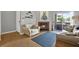 Open-concept living room with a fireplace and access to the balcony at 10265 Gandy N Blvd # 906, St Petersburg, FL 33702