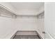 Walk-in closet with carpet and wrap around shelves and seating at 10472 Shady Preserve Dr, Riverview, FL 33578