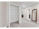 Hallway with open closet and view of bed in the main bedroom suite at 10472 Shady Preserve Dr, Riverview, FL 33578