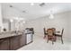 A charming eat in kitchen area with stainless steel appliances and decorative hanging lights at 10472 Shady Preserve Dr, Riverview, FL 33578