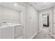 Laundry room area on the second floor near the main bedroom at 10472 Shady Preserve Dr, Riverview, FL 33578